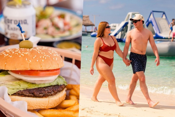 Burger and fries; couple walking on beach near inflatable water park.